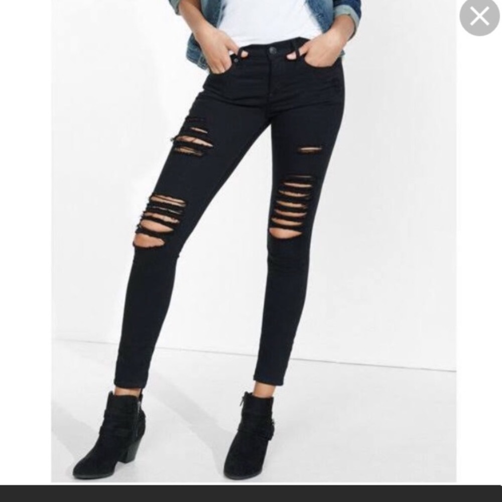 Express black mid rise distressed skinny jeans.